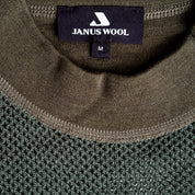 Close-up of Janus Wool green merino mesh jersey with details of crewneck