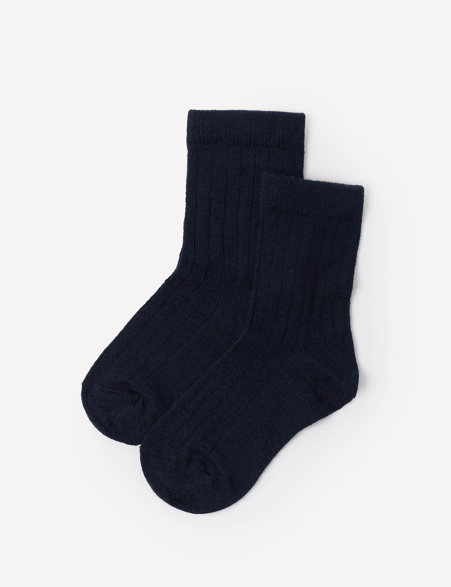 A pair of Daily Socks – Merino Kids in navy is laid side by side on a white background.