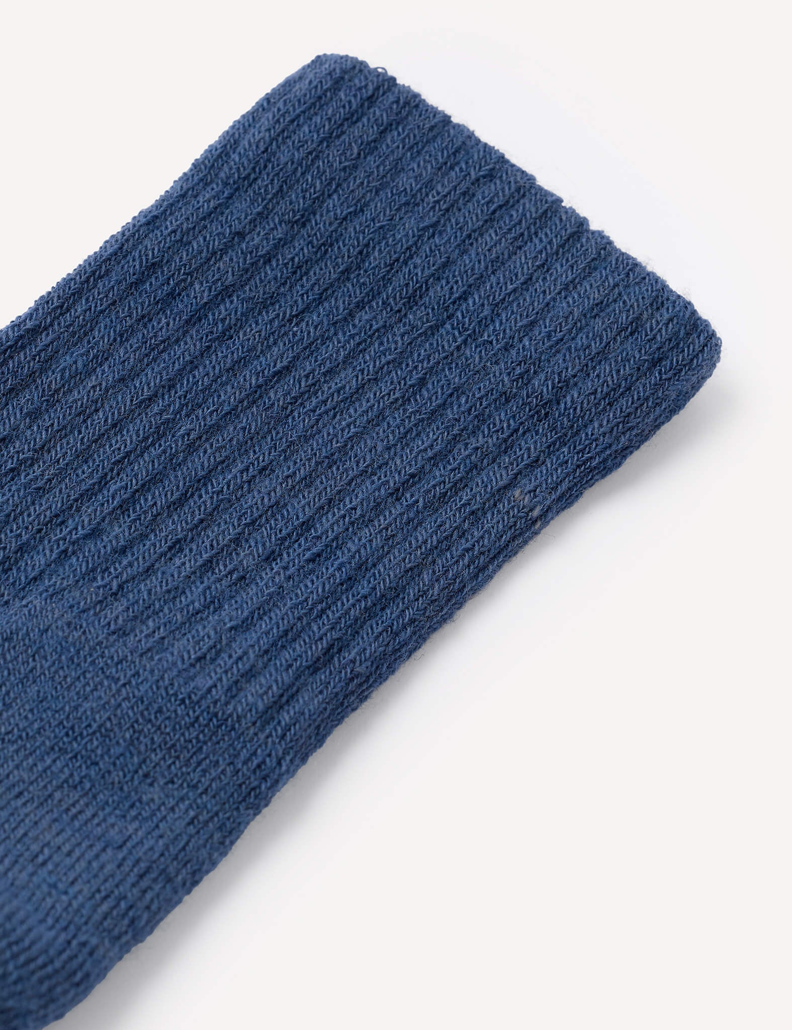 Close-up of the ribbed cuff of a Terry Socks – Merino Kids in blue, shown against a plain white background.