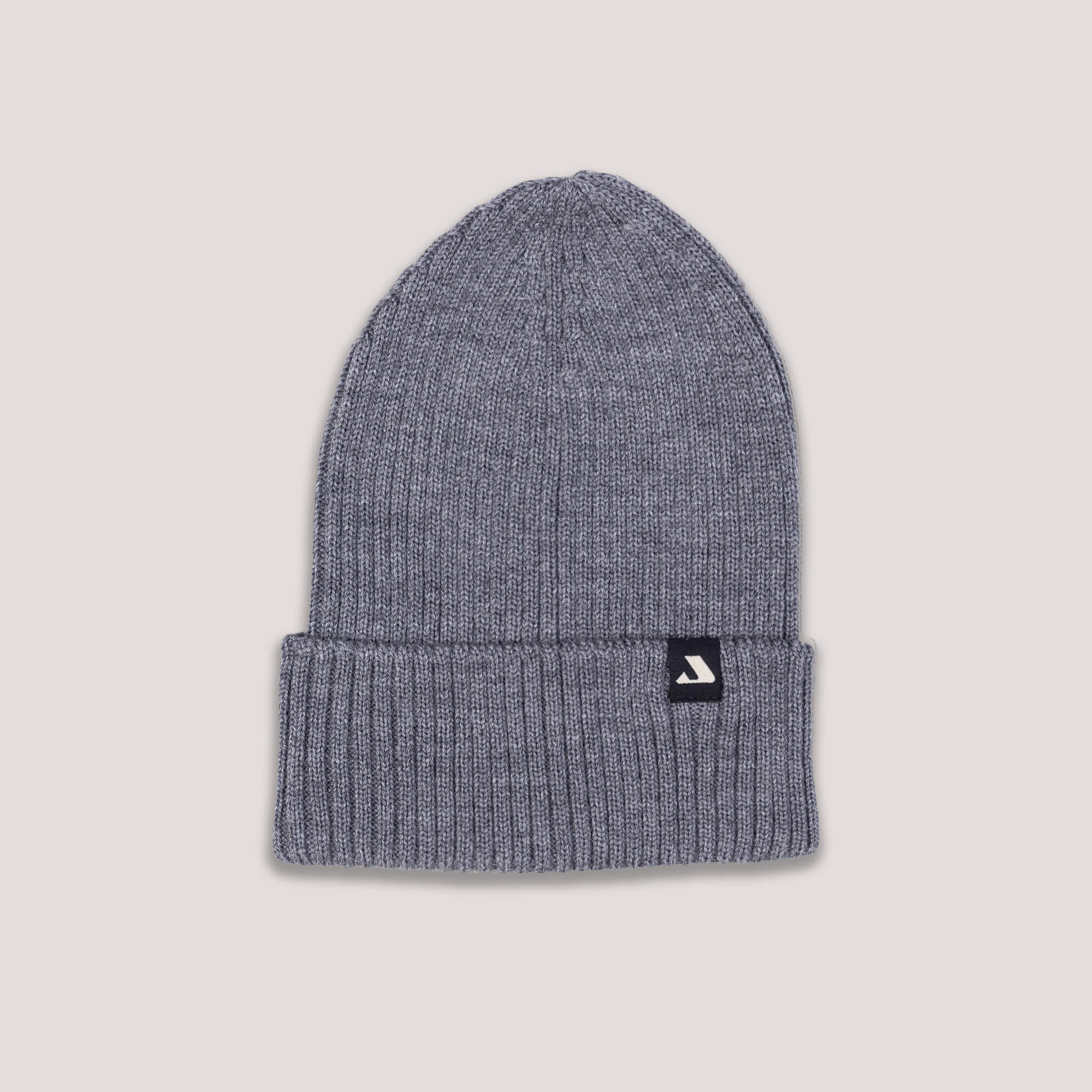 Gray knit beanie with Janus Wool logo on a light gray background
