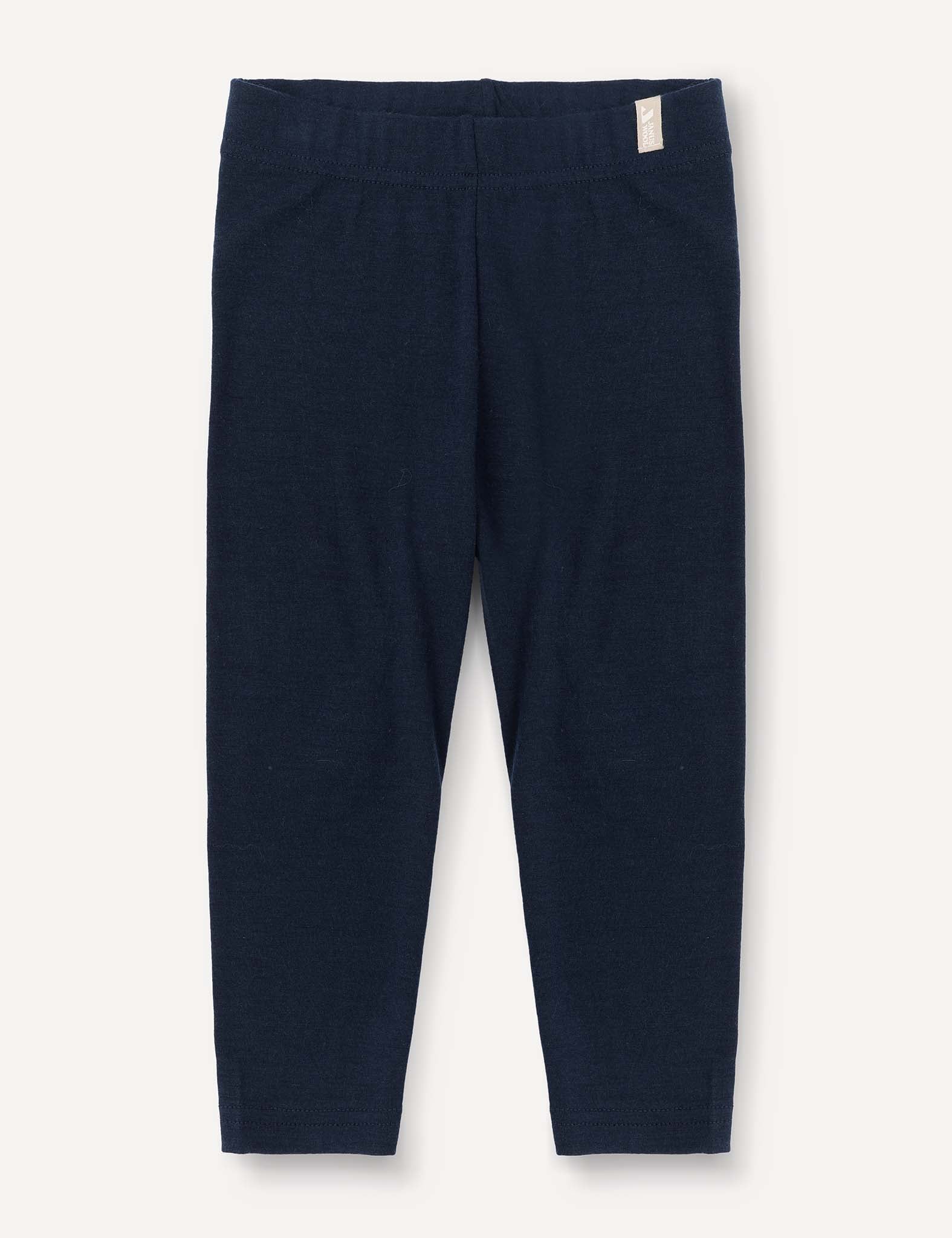 Navy Leggings – Merino Baby Light, full-length and lightweight for children, displayed flat against a white background. Featuring an elastic waistband and a small white tag on the right side near the top, these leggings are ideal as a comfortable base layer.