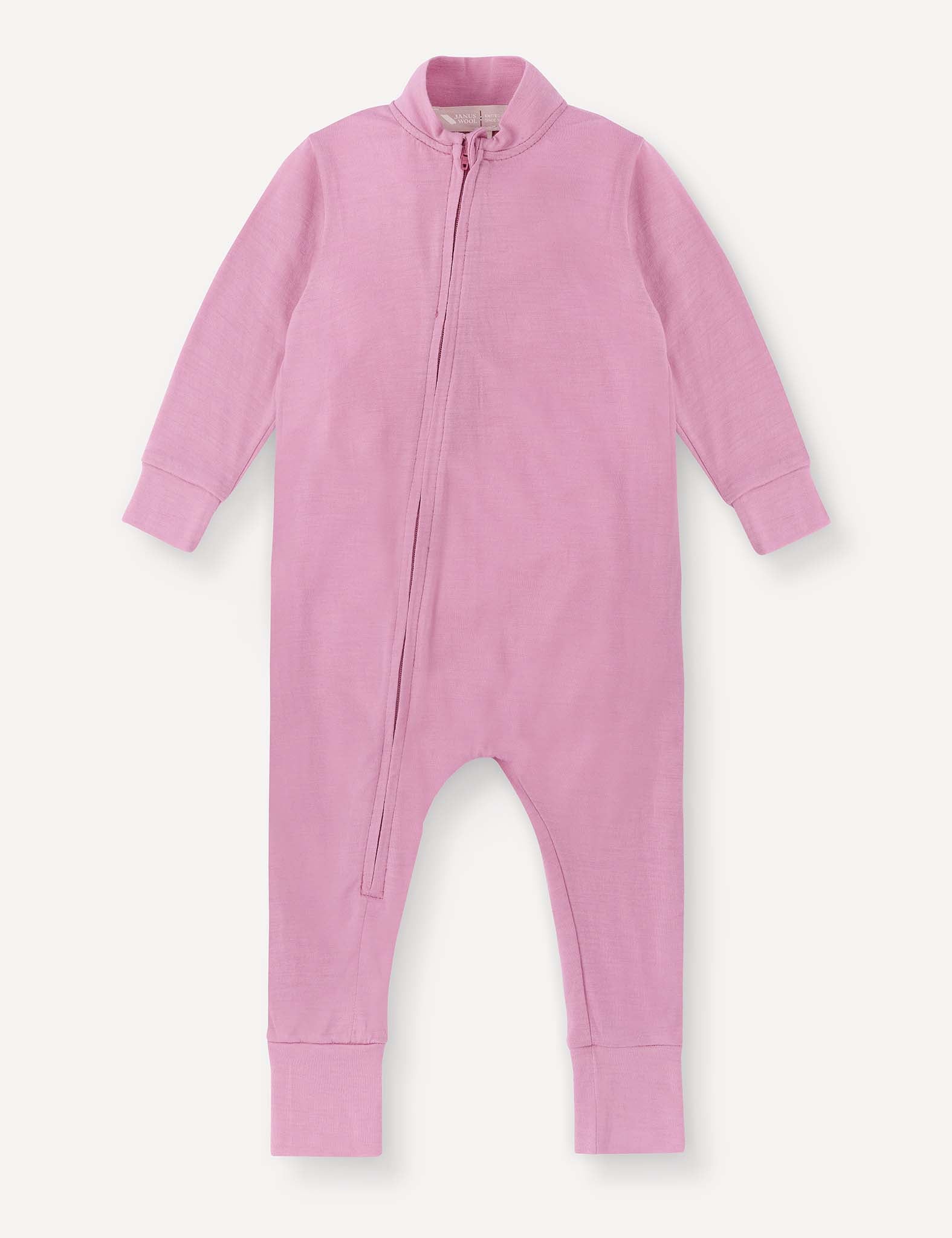 A long-sleeve mauve orchid “Pyjamas – Merino Baby Light” onesie featuring a soft, breathable fabric and ribbed cuffs, with a diagonal zipper running from the neck to the left leg.