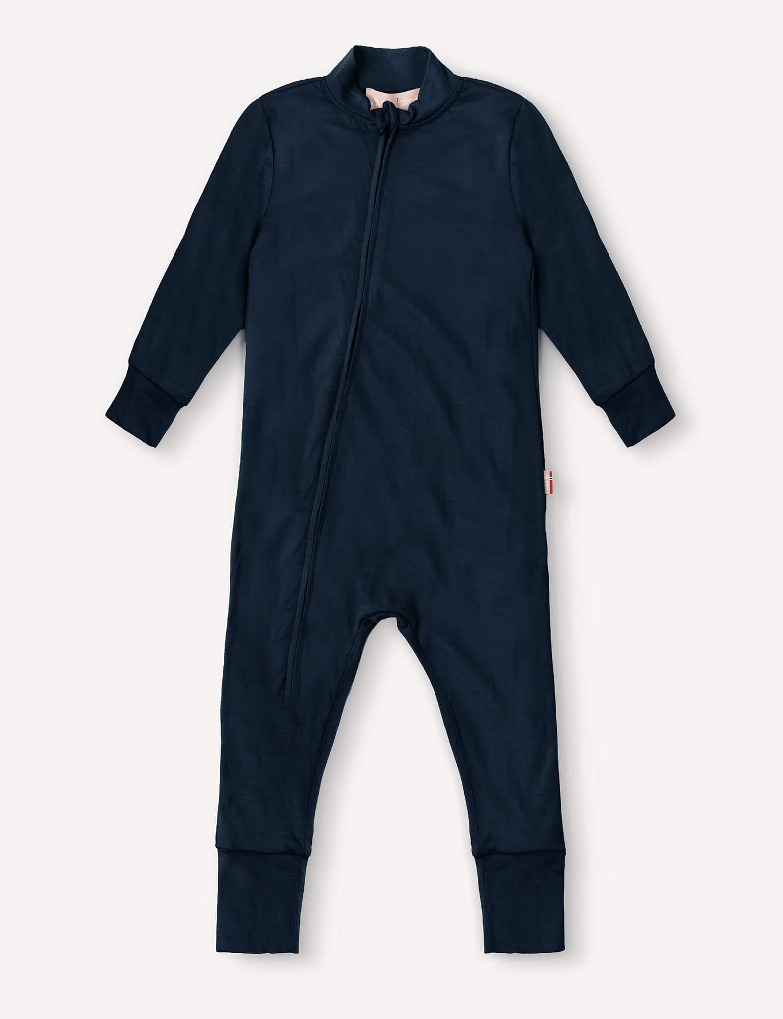 Navy Pyjamas – Merino Baby Light, a long-sleeved baby onesie with full-length legs, front zipper closure, and cuffed sleeves and feet, laid flat on a light background. Crafted from breathable nightwear fabric for extra comfort.
