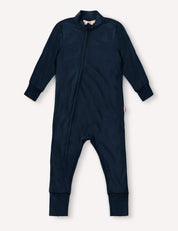 Navy Pyjamas – Merino Baby Light, a long-sleeved baby onesie with full-length legs, front zipper closure, and cuffed sleeves and feet, laid flat on a light background. Crafted from breathable nightwear fabric for extra comfort.