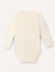 A long-sleeved, cream-colored Body – Merino Baby Light bodysuit is displayed flat on a white background, showcasing the back side. Made from breathable merino wool, this baby clothing piece offers both comfort and style for your little one.
