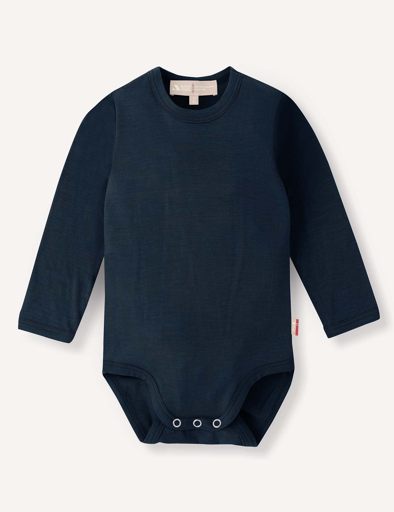 Navy Body – Merino Baby Light featuring long sleeves, a round neck, and convenient snap closures at the bottom, crafted as breathable baby clothing and displayed on a plain light background.