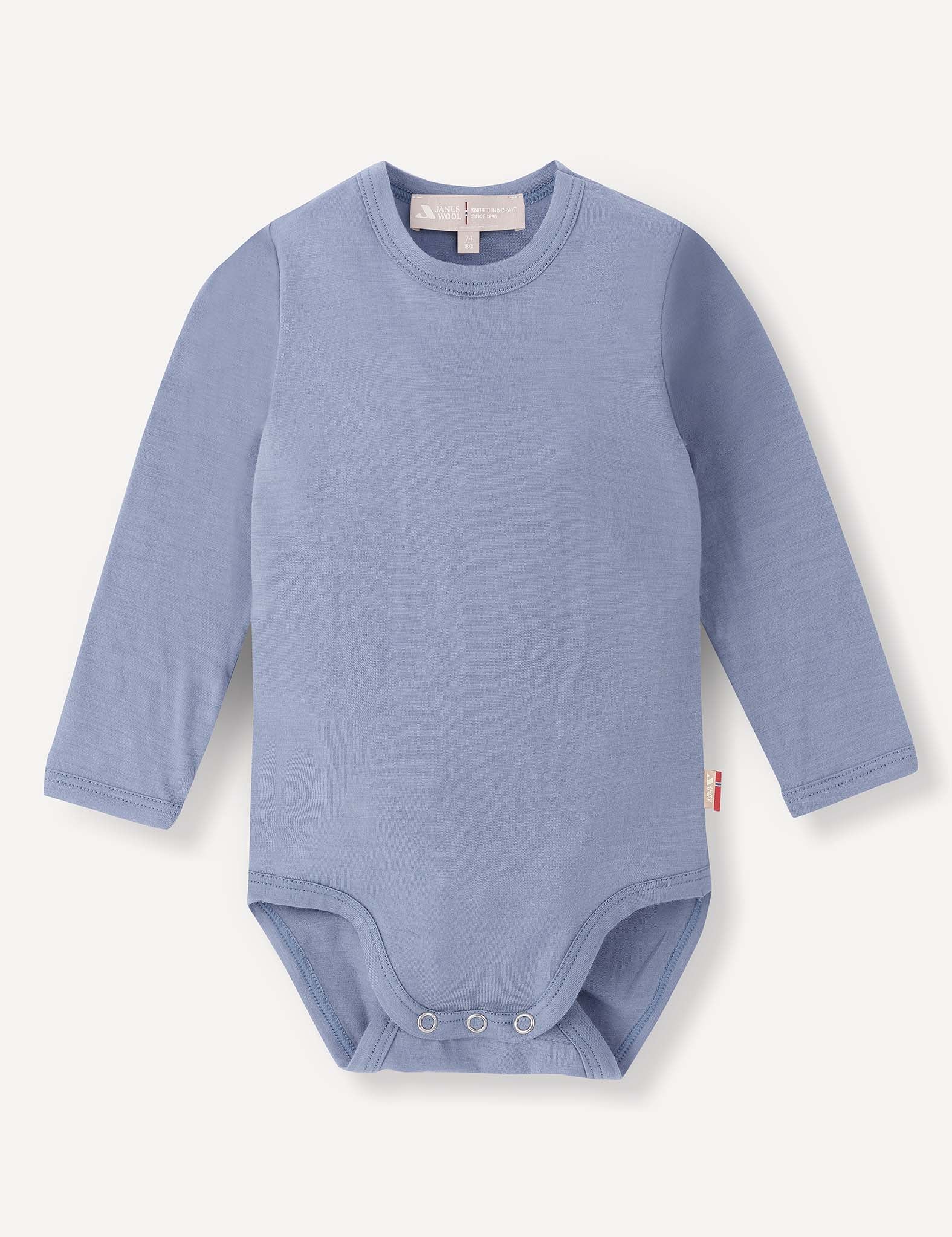 A long-sleeve baby bodysuit in the color Troposphere (light blue), named Body – Merino Baby Light, featuring snap buttons at the bottom. Displayed on a plain white background, this breathable merino baby clothing provides comfort and style for little ones.