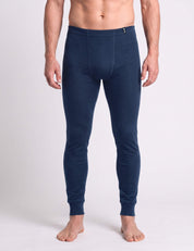 A man wearing navy blue Wool Set – Classic Merino 200 Rib Men long underwear bottoms.