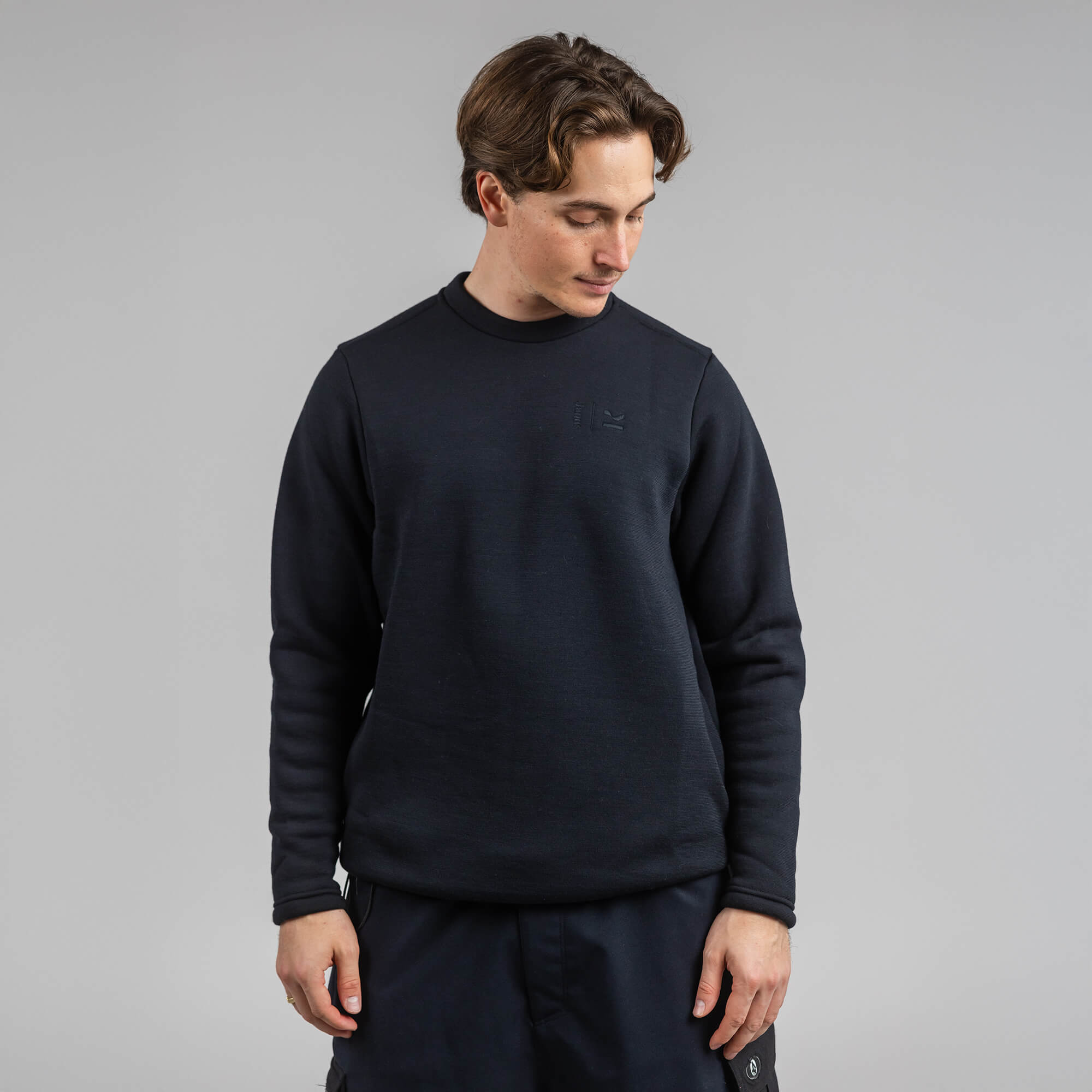 Janus x Kleveland ullfleece crew neck til herre, farge svart