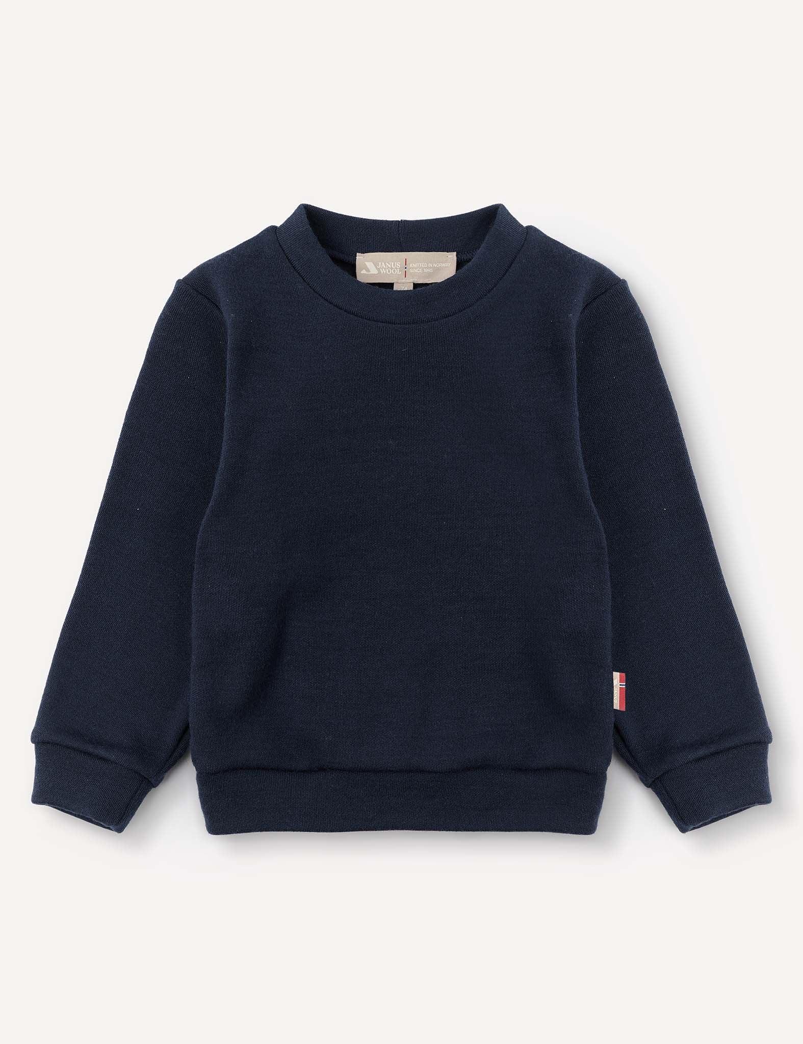 Pullover – Merino Baby AirWool in navy blue features long sleeves, a crew neckline, ribbed cuffs and waistband, and is made from brushed AirWool for breathable insulation. Shown against a plain light background.