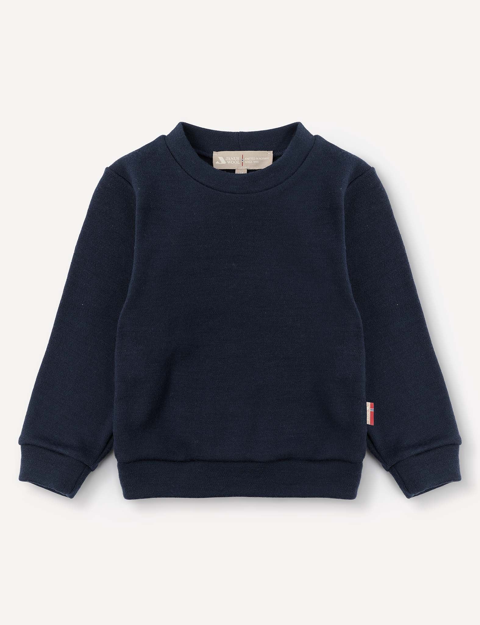 Pullover – Merino Baby AirWool in navy blue features long sleeves, a crew neckline, ribbed cuffs and waistband, and is made from brushed AirWool for breathable insulation. Shown against a plain light background.