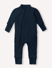 Introducing the Onesie – Merino Baby AirWool in navy, a long-sleeved, full-length suit crafted from breathable merino wool for optimal insulation. Featuring a diagonal front zipper from neck to leg and fold-over cuffs for extra comfort.