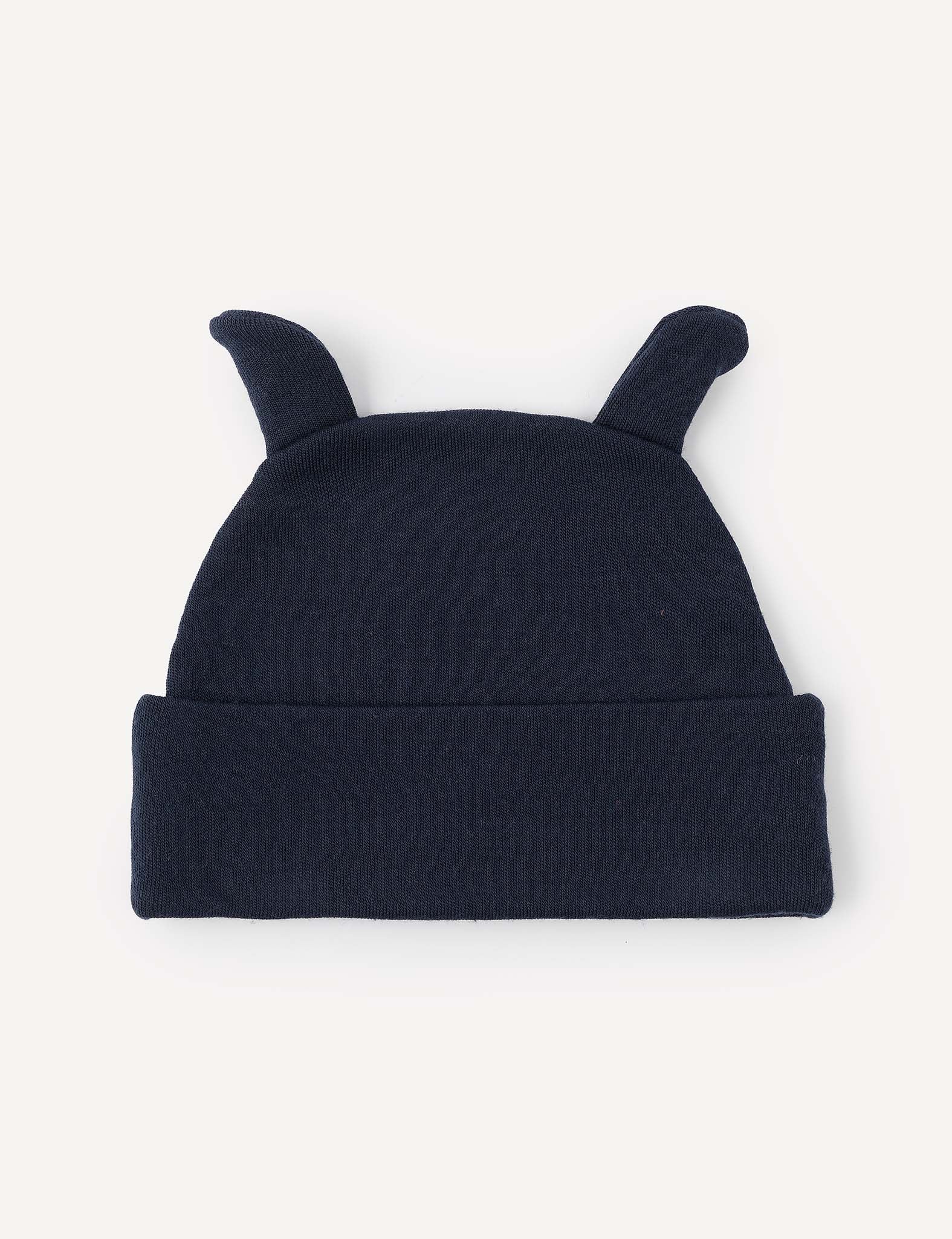 The Beanie – Merino Baby AirWool is a dark blue knit baby beanie with two small, pointy fabric ears on top, made from breathable merino wool and displayed against a plain light background.