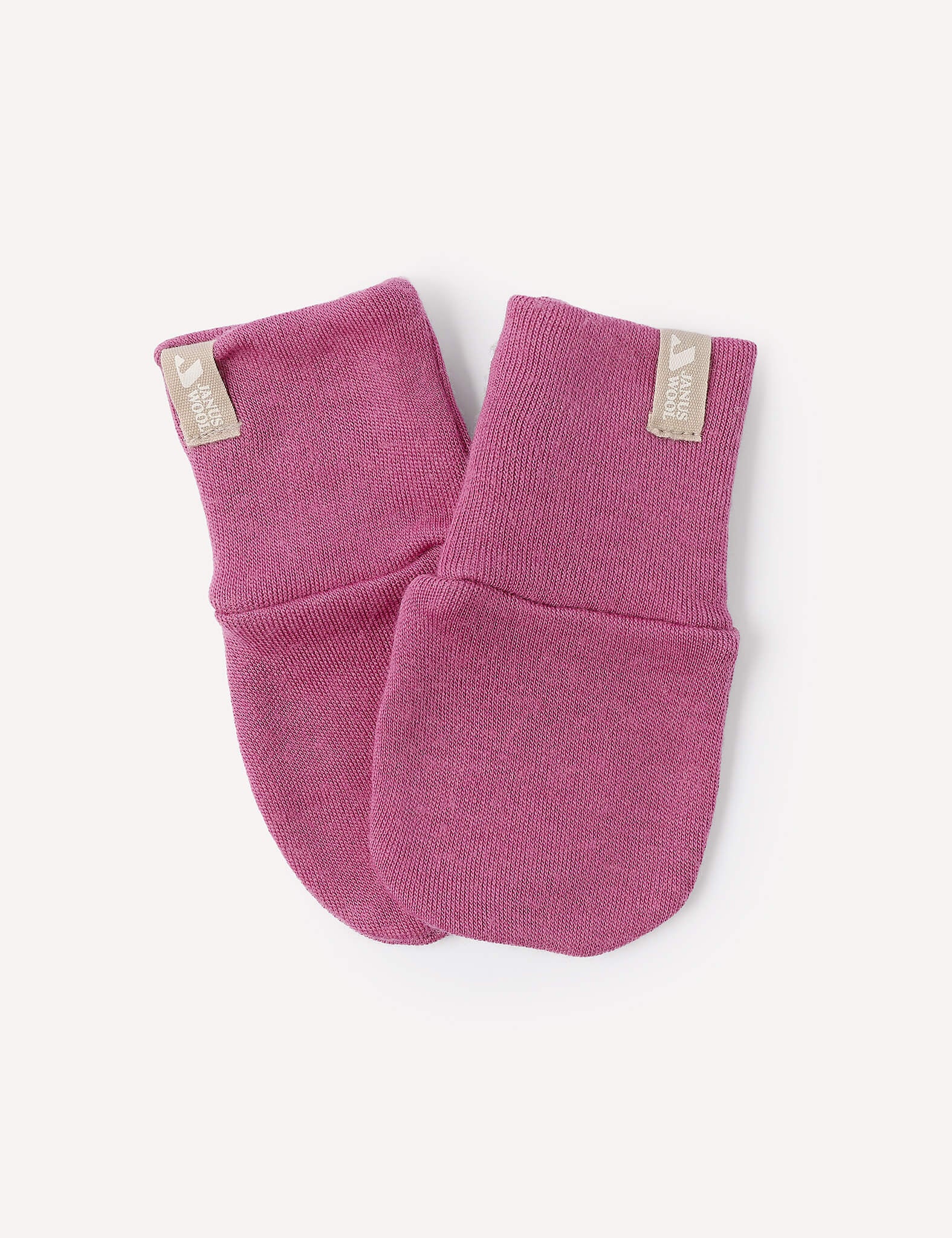 A pair of Merino Baby AirWool Mittens in Hawthorn Rose, made from soft AirWool fabric, laid on a white background. Each mitten features a beige tag near the cuff.