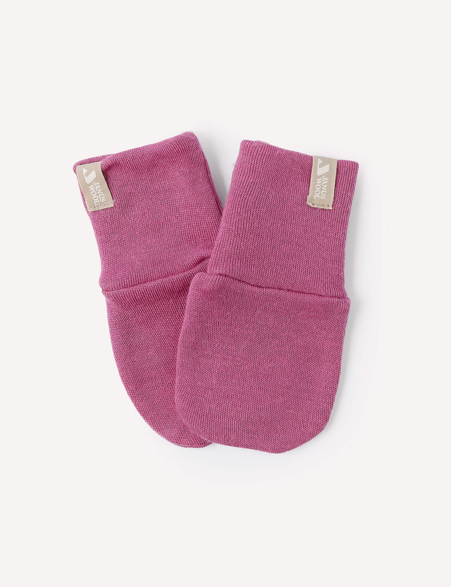 A pair of Merino Baby AirWool Mittens in Hawthorn Rose, made from soft AirWool fabric, laid on a white background. Each mitten features a beige tag near the cuff.
