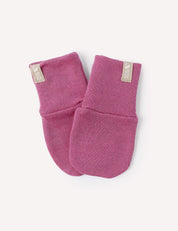 A pair of Merino Baby AirWool Mittens in Hawthorn Rose, made from soft AirWool fabric, laid on a white background. Each mitten features a beige tag near the cuff.