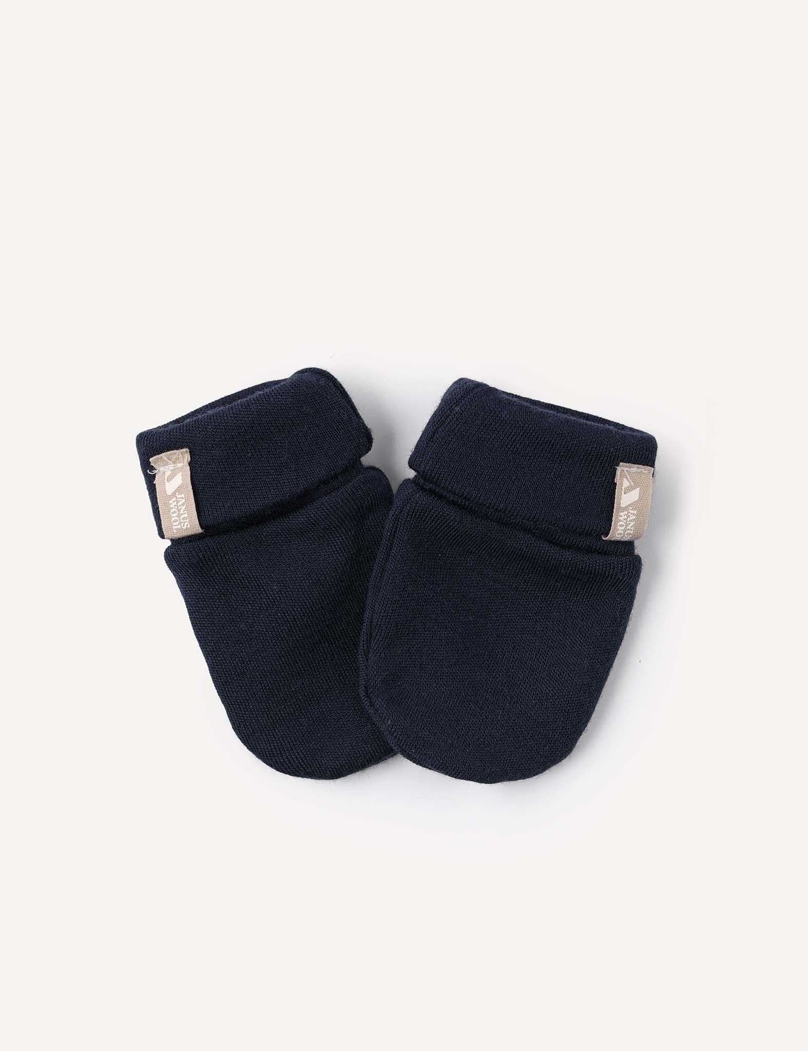 A pair of Mittens – Merino Baby AirWool in dark navy blue, featuring warm fabric, folded cuffs, and small beige tags, displayed on a plain light background.