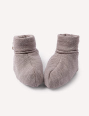 A pair of Booties – Merino Baby AirWool in Beige Melange are placed side by side on a plain white background.