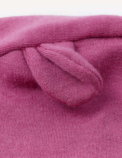 Close-up of the pink Balaclava – Merino Baby AirWool, showing a small, rounded fabric ear or knob sewn onto its knitted fabric—suggesting its breathable and comfortable design.