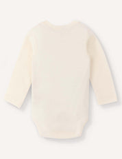 A long-sleeve Body – Merino Baby AirWool in cream is displayed laid flat, with the back side facing up against a plain white background, showcasing its breathable merino wool comfort for your baby.
