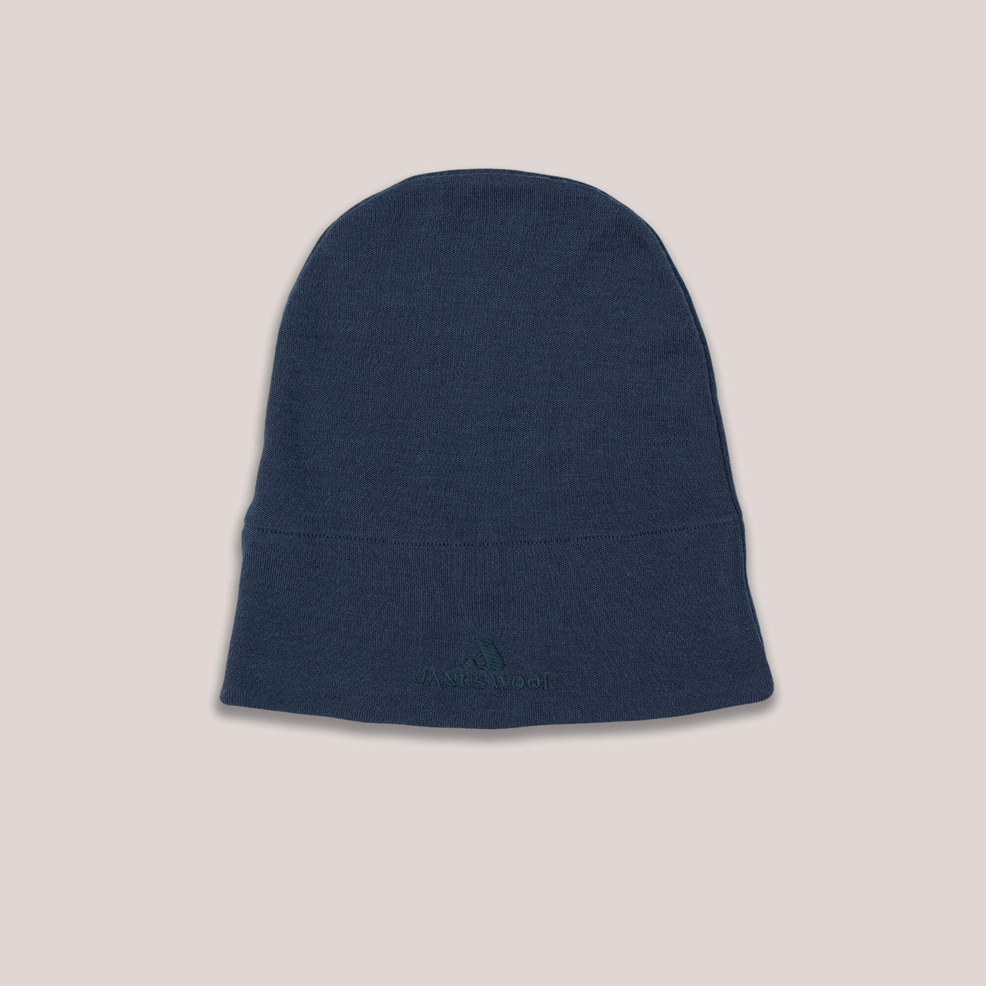 Blue Janus AirWool beanie on a light gray background