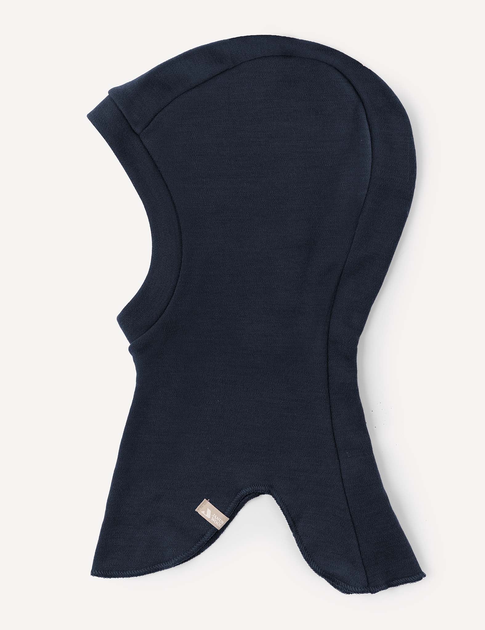 A warm navy blue Balaclava – Merino Kids AirWool made from soft fabric, designed to cover the head, neck, and part of the shoulders, featuring a small fabric tag near the bottom edge.