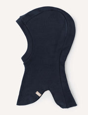 A warm navy blue Balaclava – Merino Kids AirWool made from soft fabric, designed to cover the head, neck, and part of the shoulders, featuring a small fabric tag near the bottom edge.