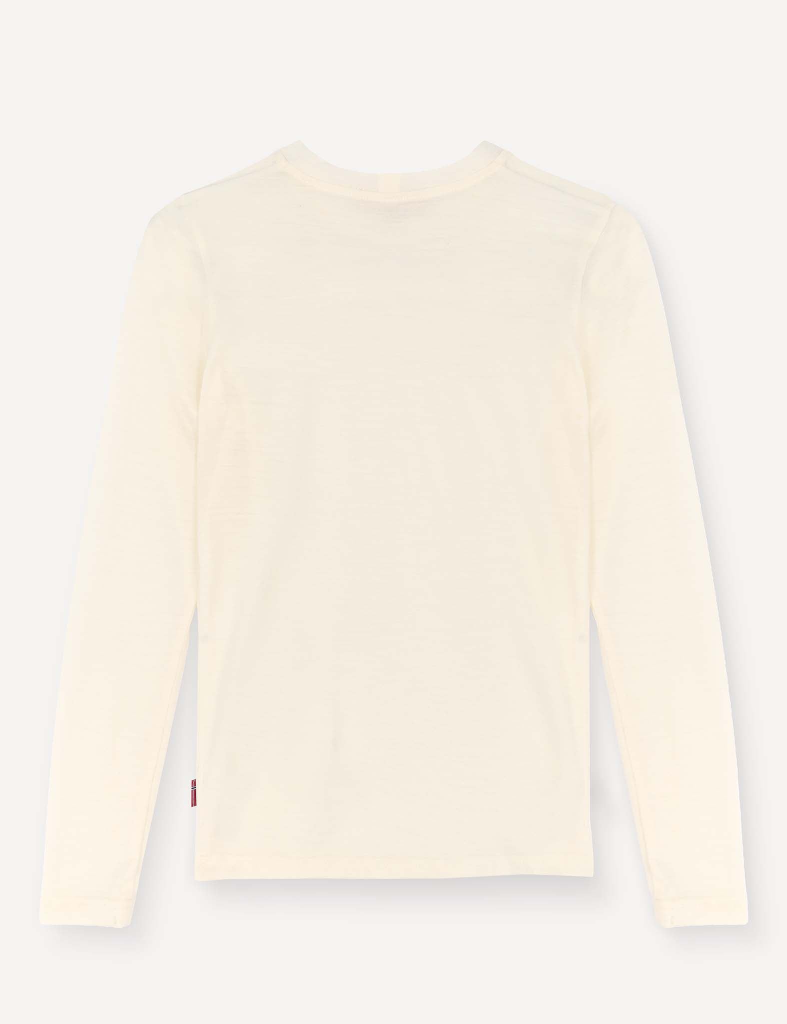 The Crewneck – Merino Kids Light, a plain, long-sleeve shirt in a cream color made from soft merino wool jersey, is laid flat with the back side facing up against a light background.