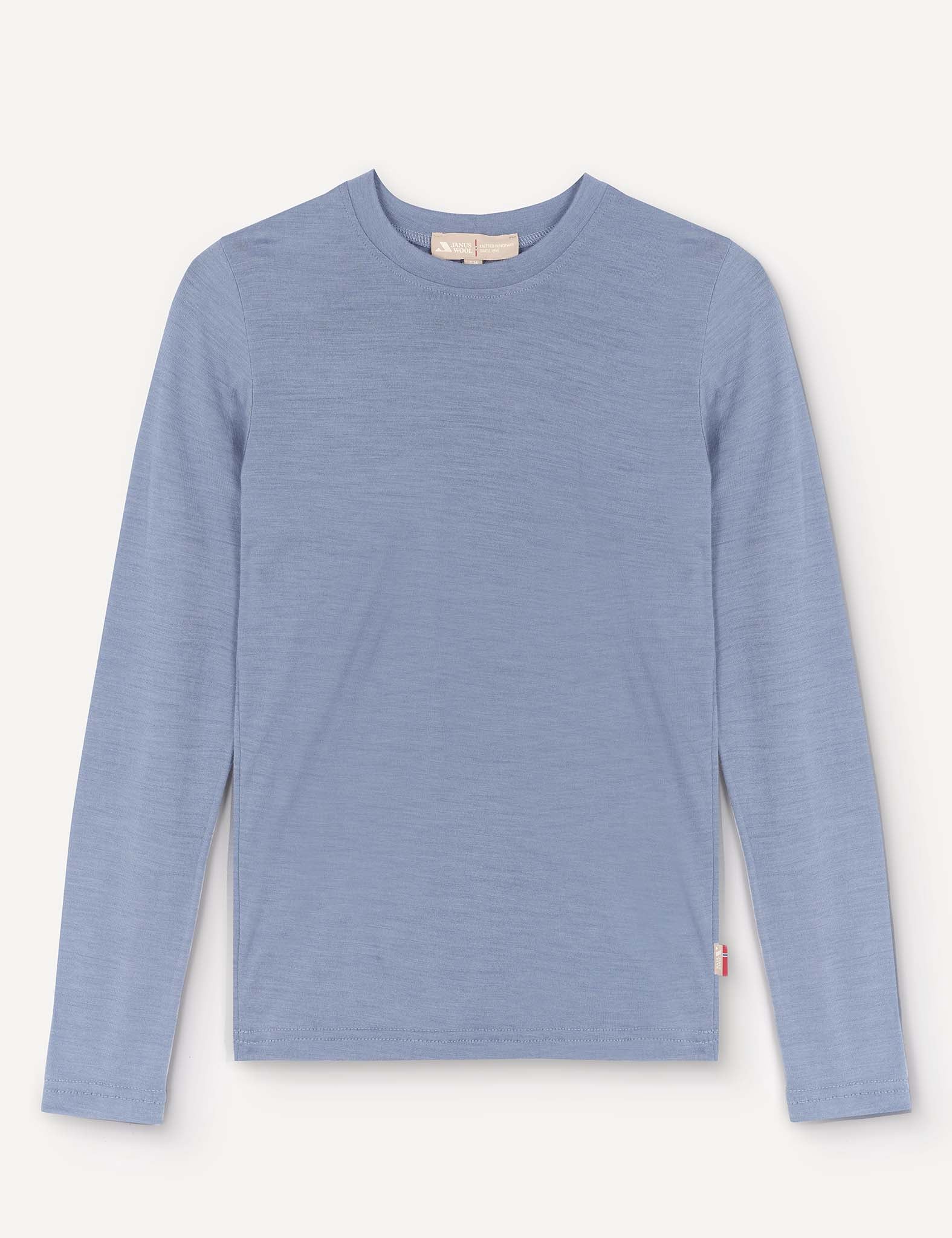 A Crewneck – Merino Kids Light shirt in Troposphere, featuring long sleeves and a crew neckline, is displayed laid flat on a plain background. Made from soft merino wool, the shirt has a simple design without visible patterns or logos, except for a small red tag on the lower side seam.