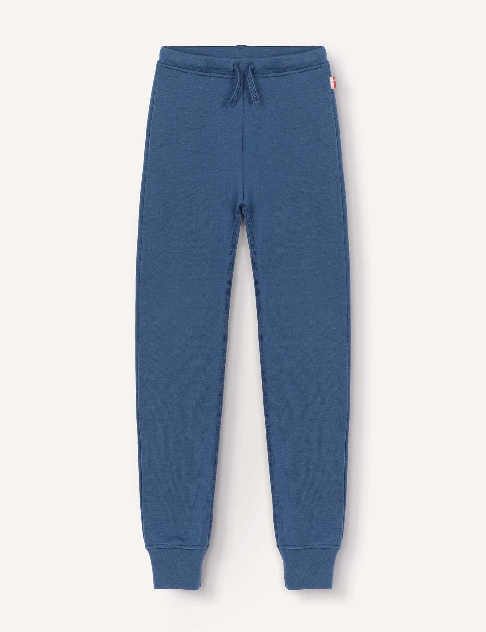 A pair of Merino Kids AirWool sweatpants in blue, featuring a warm design with an elastic waistband, drawstring, and cuffed ankles, displayed flat on a light background.