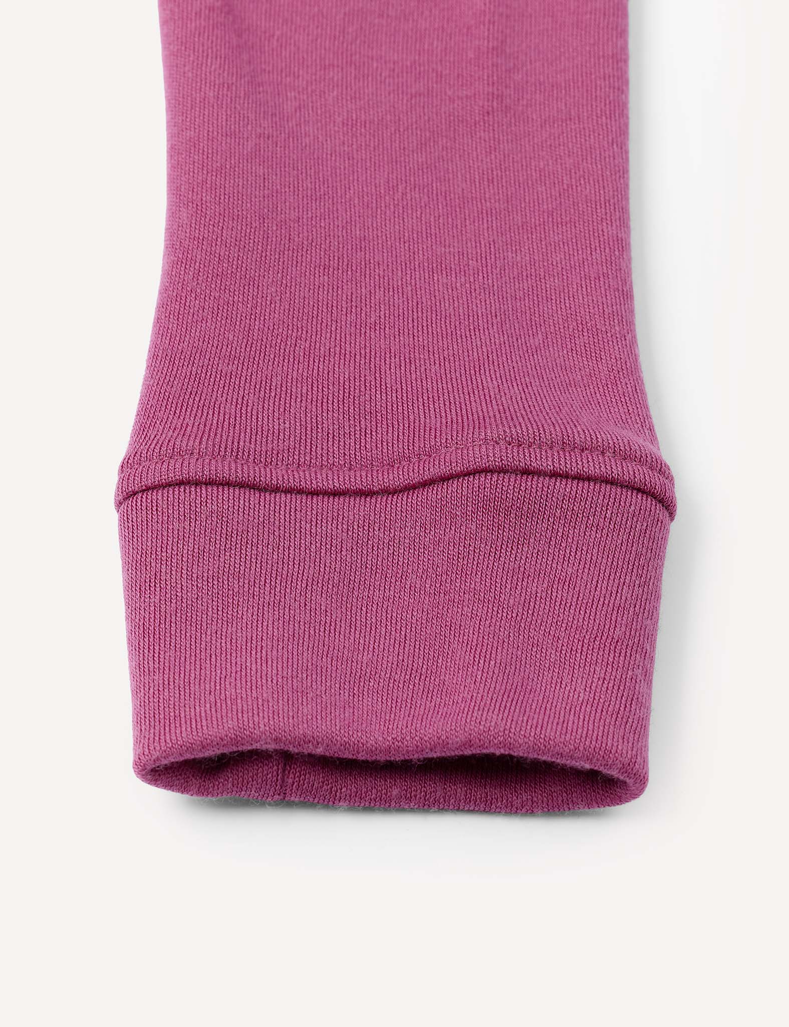 Close-up of the cuff of the Leggings – Merino Kids AirWool, made from pinkish-purple AirWool knit fabric, shown against a plain white background.