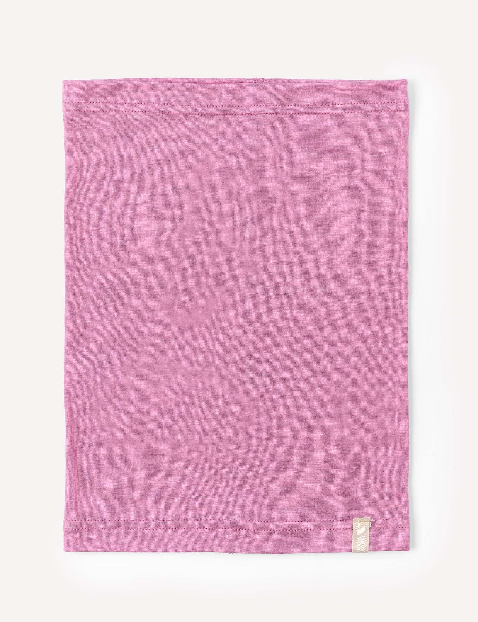 A mauve orchid, rectangular Neckwarmer – Merino Kids Light is laid flat on a white background, featuring visible stitching along the top and bottom edges and a small white tag sewn near one corner.